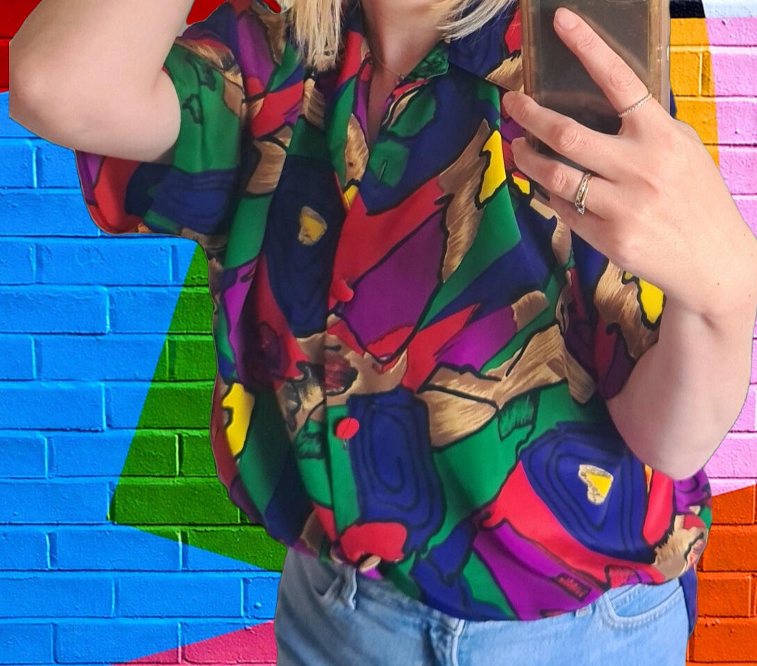 model wearing vintage multicolored top